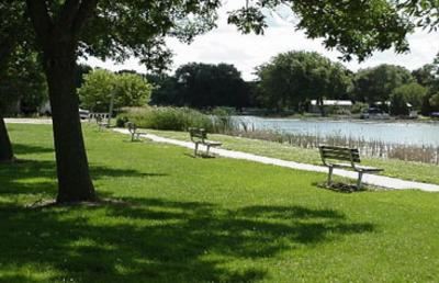 Benches line the walkway at Riverside Park